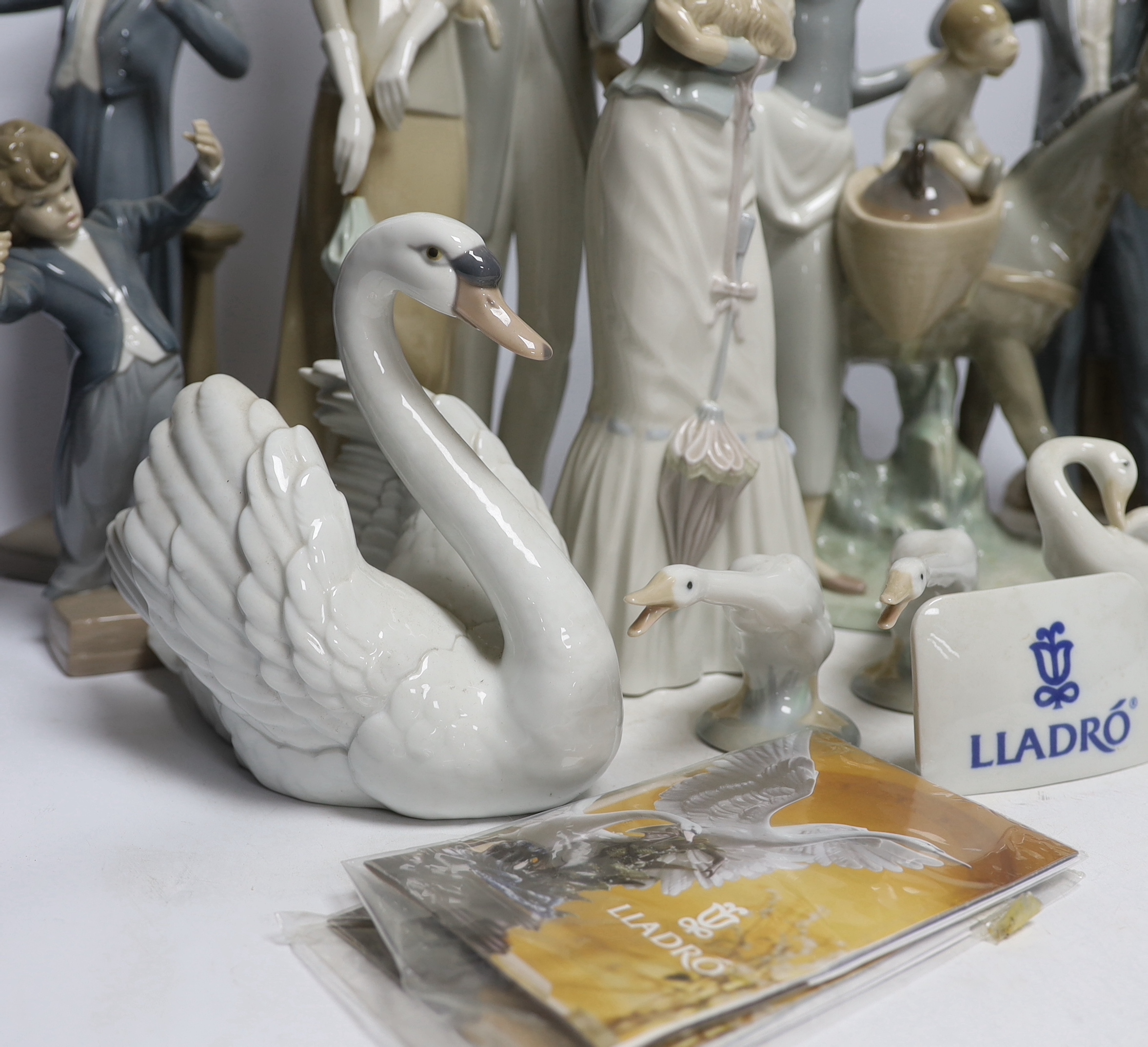 A collection of various Lladro figures including composers, swans, etc. tallest 50cm